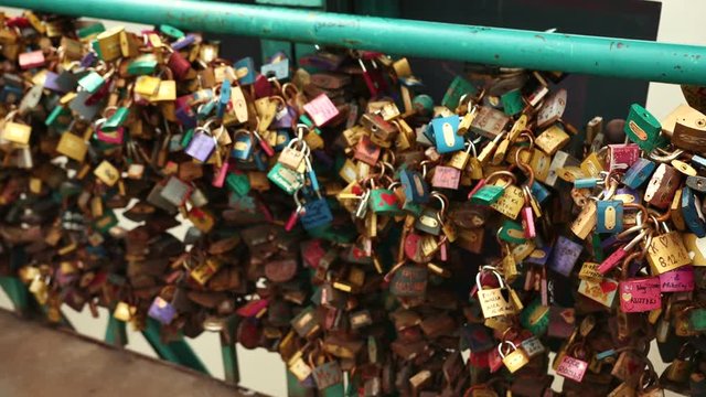 Love locks on the Bridge over the River. Many characters that signify the love of a young couple to each other forever