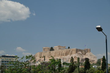 Ancient temple and clear blue sky and clouds in the Acropolis in a sunny day in the capital of...