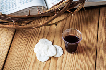 Holy Communion, a Cup of Wine and Bread with a Jesus Crown Thorn and Holy Bible