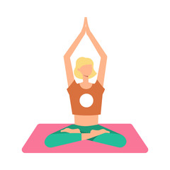 A blond woman is meditating in the lotus position on a yoga mat with legs crossed, arms raised.