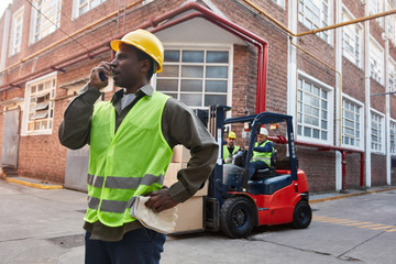 Worker coordinates delivery via radio