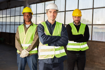 Three confident logistics workers