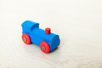 Obraz premium Child'd wooden train on the white floor