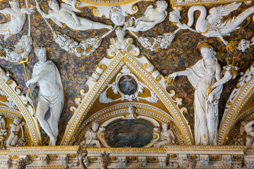 Fototapeta na wymiar Sculpture in the Doge's Palace, the interior decoration of the walls and ceiling. Venice, Italy.