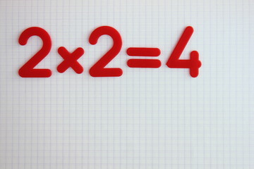A simple mathematical example in a clean school notebook. Back to school.