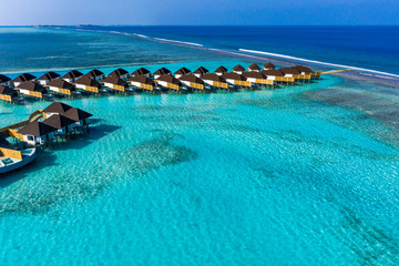 Aerial view, Maldives island with water bungalows, South Male Atoll Maldives