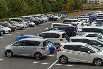 Fototapeta na wymiar row of cars parked in outdoor parking