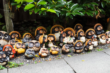 Japanese Tanuki statue in a traditional garden in Kyoto, Japan