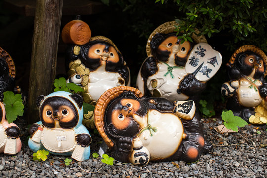 Japanese Tanuki statue in a traditional garden in Kyoto, Japan