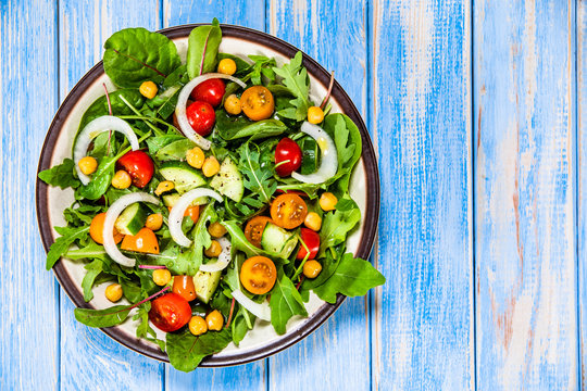 Greek Salad With Chickpea On Wooden Background