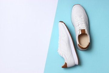 men's sneakers on a colored background top view. men's footwear. minimalism