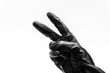 Female hand turned back in black gloves show gestures, signs and symbols isolated on white...