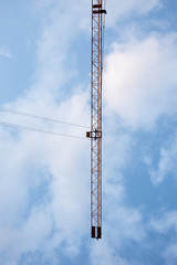 Obraz premium Construction of a skyscraper with tower cranes