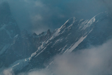 Clouds covering the snow covered mountains in Kedarnath, Uttarakhand, India