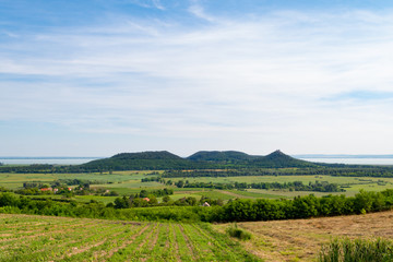 Lake Balaton scenery with the Castle Hill of Szigliget and other volcanic monadnocks of Balaton Highlands seen from Hegymagas, Saint George Hill