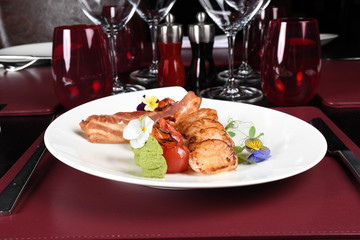 Fried scallops with green peas puree. Elegant and luxury haute cuisine plating in a luxury restaurant setting. Top view, copy space