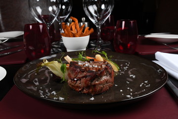 Rib eye steak, seasonal vegetables and sweet potatoes Fries