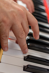 hands playing piano