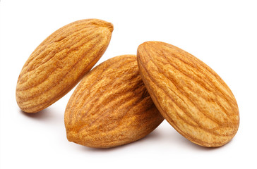 Obraz na płótnie Canvas Close-up of three almonds, isolated on white background