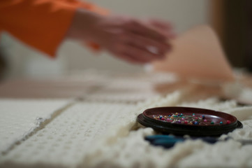 Fototapeta na wymiar A set of needles on a background of seamstress. Handmade. Craft 