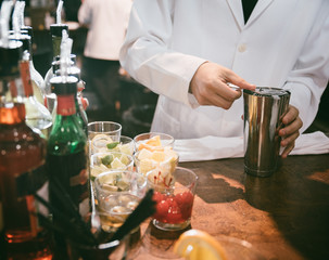 Bartender making drinks for customers