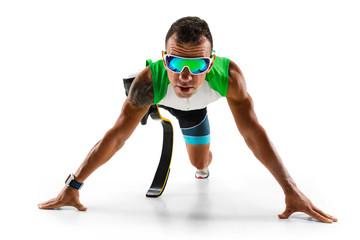 Athlete with disabilities or amputee isolated on white studio background. Professional male runner with leg prosthesis training and practicing in studio. Disabled sport and healthy lifestyle concept.