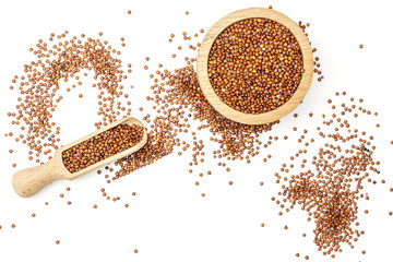 Lot of whole raw red quinoa seeds in a wooden bowl with wooden scoop flatlay isolated on white background