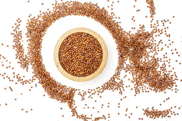 Lot of whole raw red quinoa seeds in a wooden bowl in a circle isolated on white background