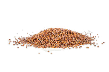 Lot of whole raw red quinoa seeds heap isolated on white background