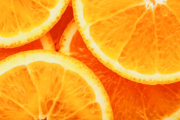 Round orange slices, in the form of texture and lanterns of fresh juicy slices