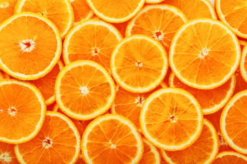 Round orange slices, in the form of texture and lanterns of fresh juicy slices