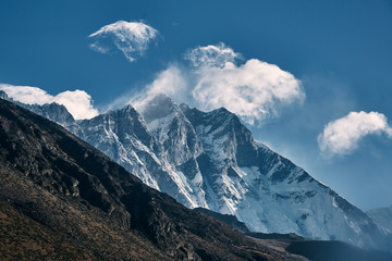 Harsh mountain landscape of rocky and snowy Himalayan peaks.