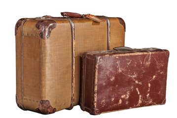two old-fashioned scratched brown suitcases - white, isolated