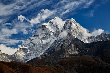 Himalayas mountain landscape. A steep snowy peak on a beautiful sunny day.