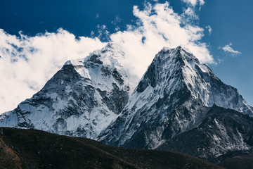 Himalayas mountain landscape. A steep snowy peak on a beautiful sunny day.