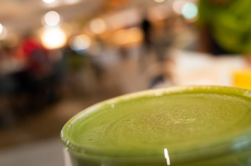 cup of matcha milk tea on table