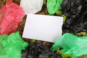 A bunch of reusable, multi-colored plastic bags polluting the environment.