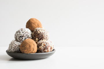 Homemade energy balls with cacao, coconut. Healthy food for children and vegan, sweets substitute.