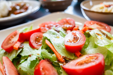 salad with red tomato and green lettuce