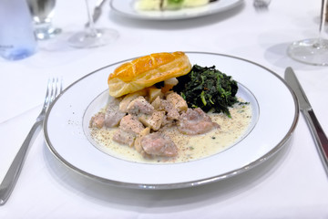 chicken steak white sauce served with puff and vegetables