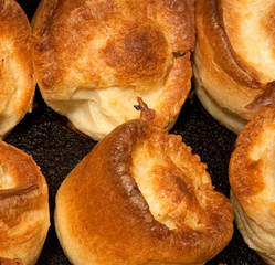 Traditional Yorkshire puddings typically served as a side with an English Sunday Roast dinner