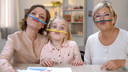 Comic females fooling around with pencils, having fun together, creativity