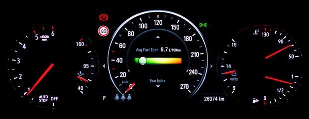 Modern illuminated car instrument panel with speedometer, tachometer, odometer, car's temperature...