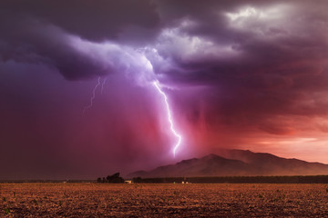 Lightning bolt striking a mountain in a storm