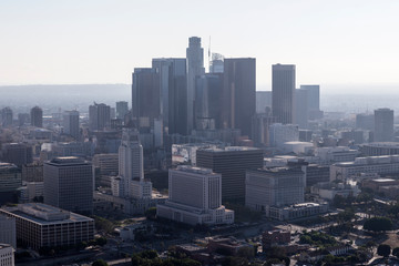 Smoggy afternoon aerial of buildings and streets in downtown Los Angeles, California.  