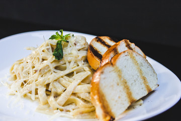 pasta alfredo with bread