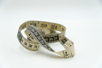 Measuring tape on white background