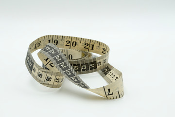 Measuring tape on white background