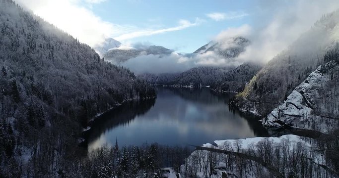 Lake Ritsa in the New Year holidays in January in the mountains of Abkhazia (Georgia) A series of unique source videos in 4K filmed by a professional drone from a winter trip 