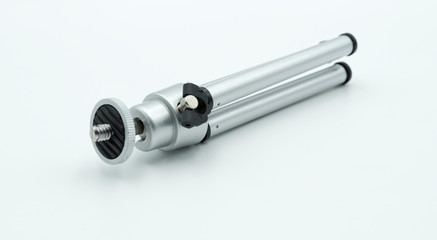 Small silver-colored tripod for photo or video